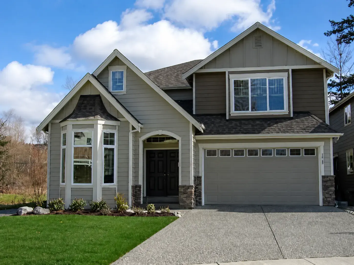 Completed white and gray Eastside siding project